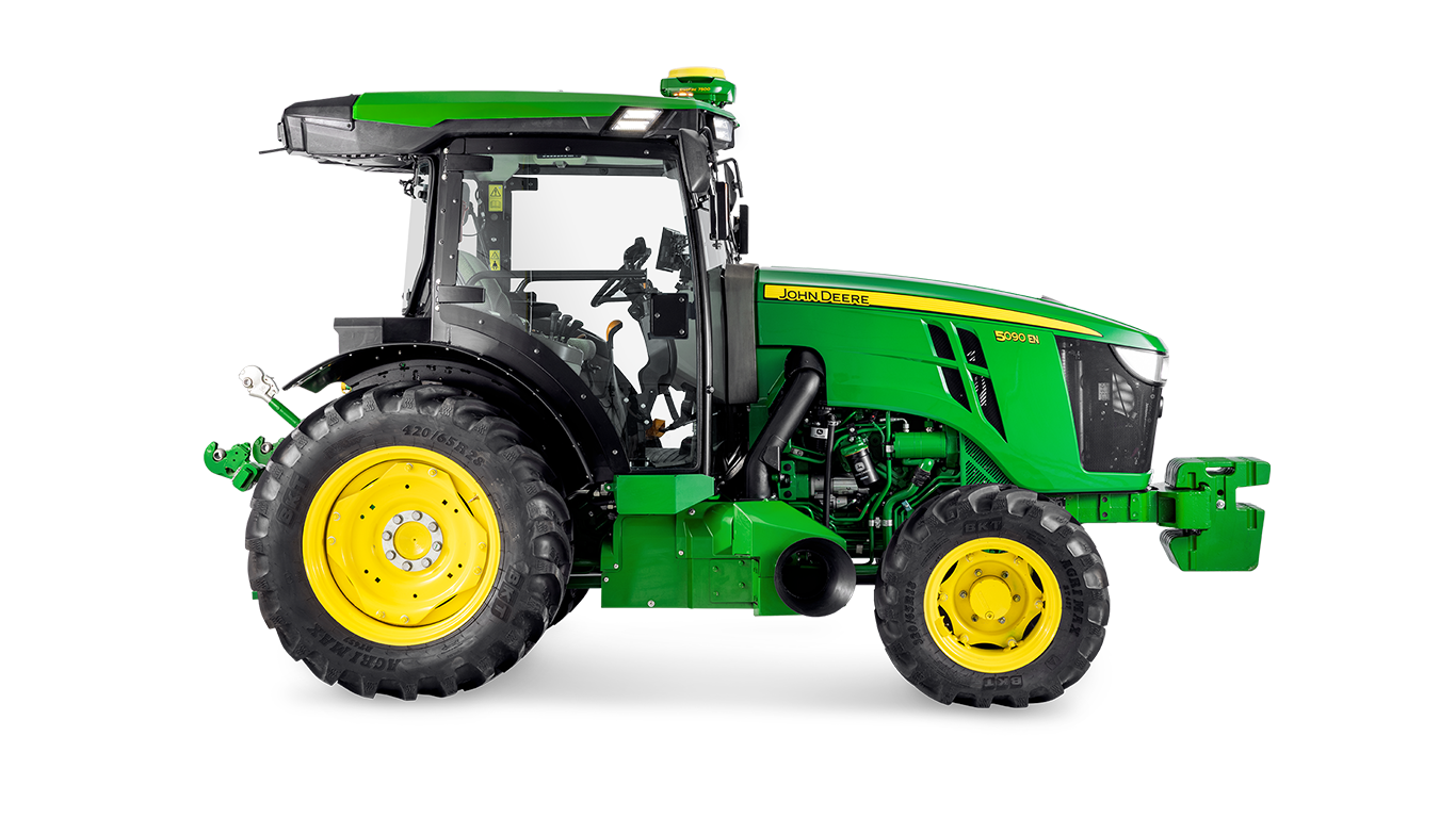 Πλευρικό προφίλ ενός τρακτέρ 5090EN της John Deere, που επισημαίνει τη σχεδίαση της καμπίνας και τα μεγάλα πίσω ελαστικά.